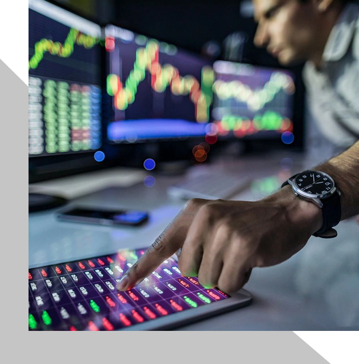 A man is pointing to the bottom of his keyboard.